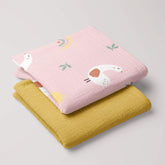 Lady Goose muslin swaddle and mustard yellow 4-ply blanket folded as a matching baby set